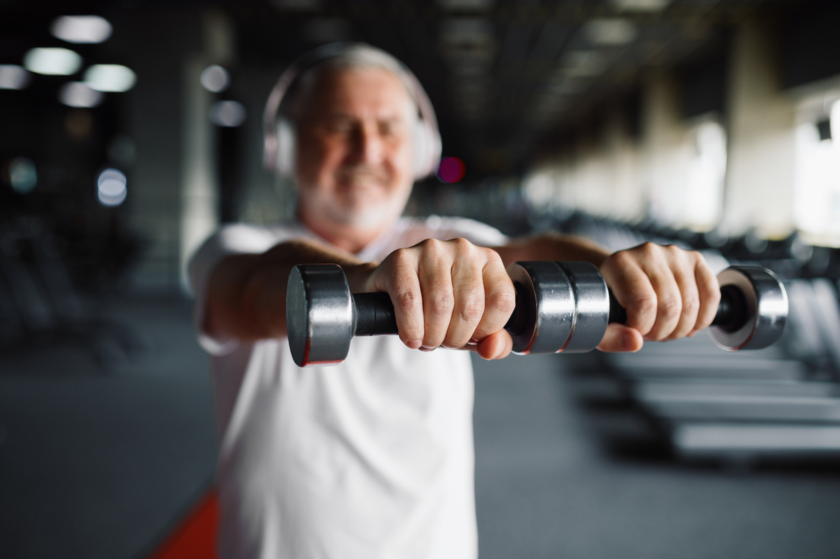 Old Man in Headphones, Exercise with Dumbbells